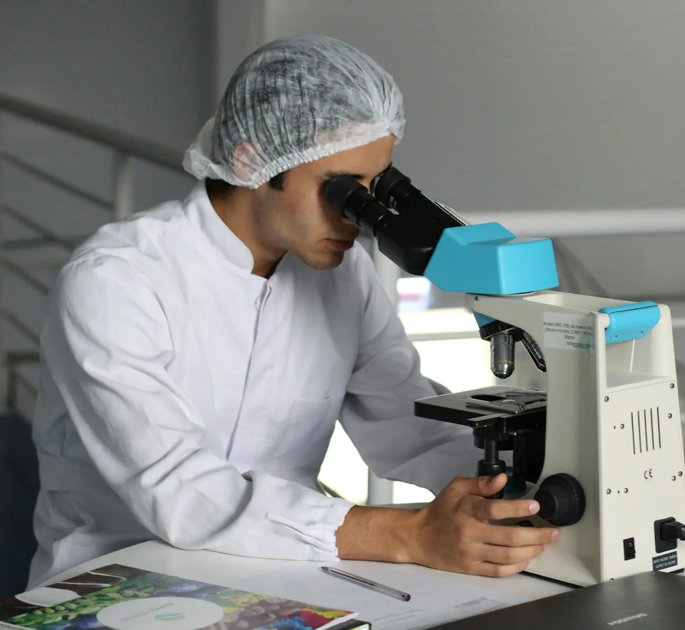 man sight on white microscope